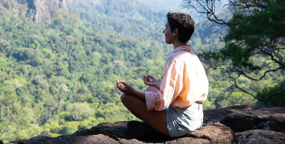 Woman meditating in nature