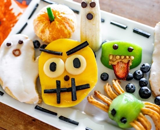 Halloween ghost biscuits and fruity treats